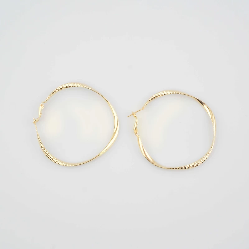 Gold twisted Creole earrings - Pomme Cannelle