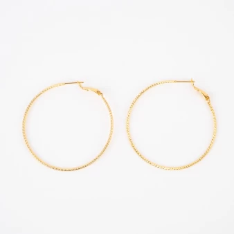 Chiseled gold hoop earrings...