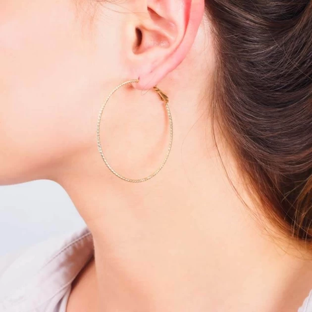 Chiseled gold hoop earrings...