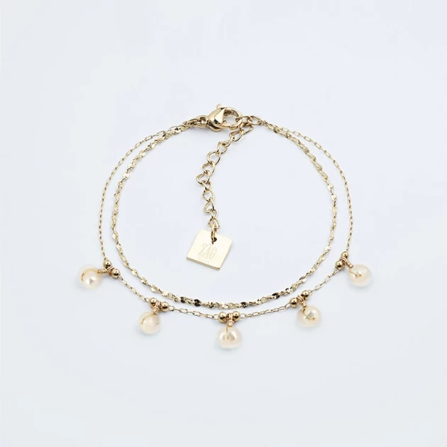 White pearls gold bracelet...