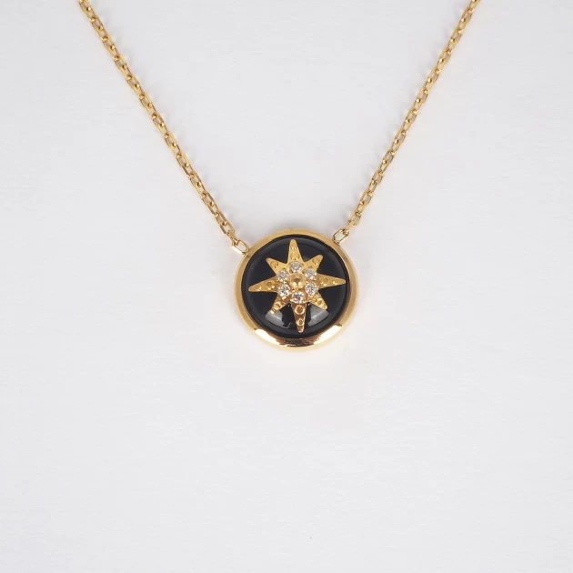 Black star necklace in gold...